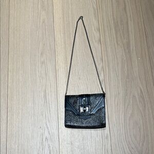 Elegant Black Crossbody Bag with Buckle Detail